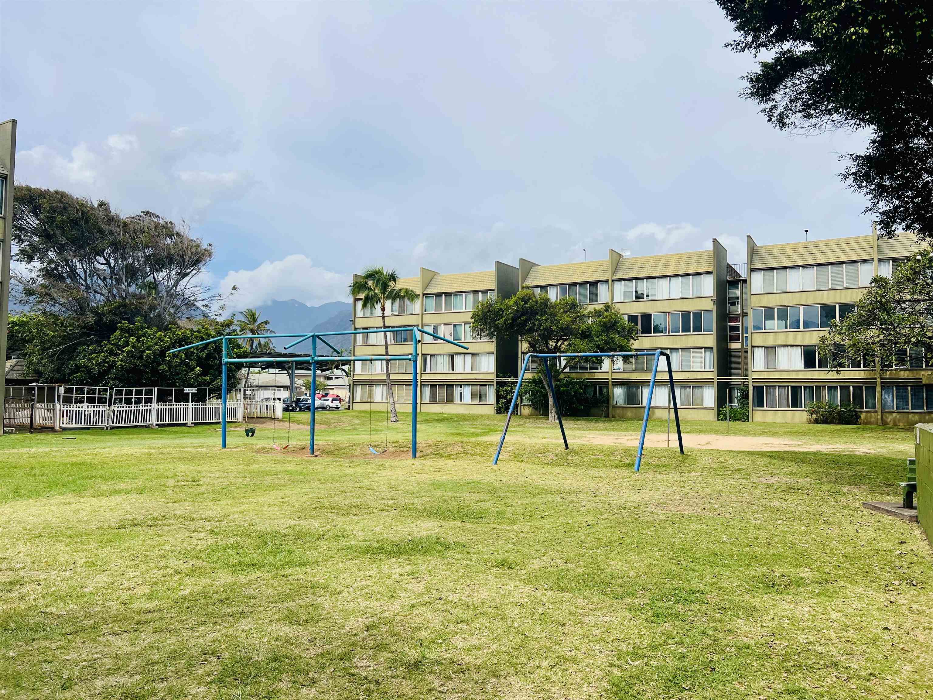 111 Kahului Beach Road, Unit D225 Kahului, HI 96732 - Photo 29 of 31 a view of swimming pool with lawn chairs and trees