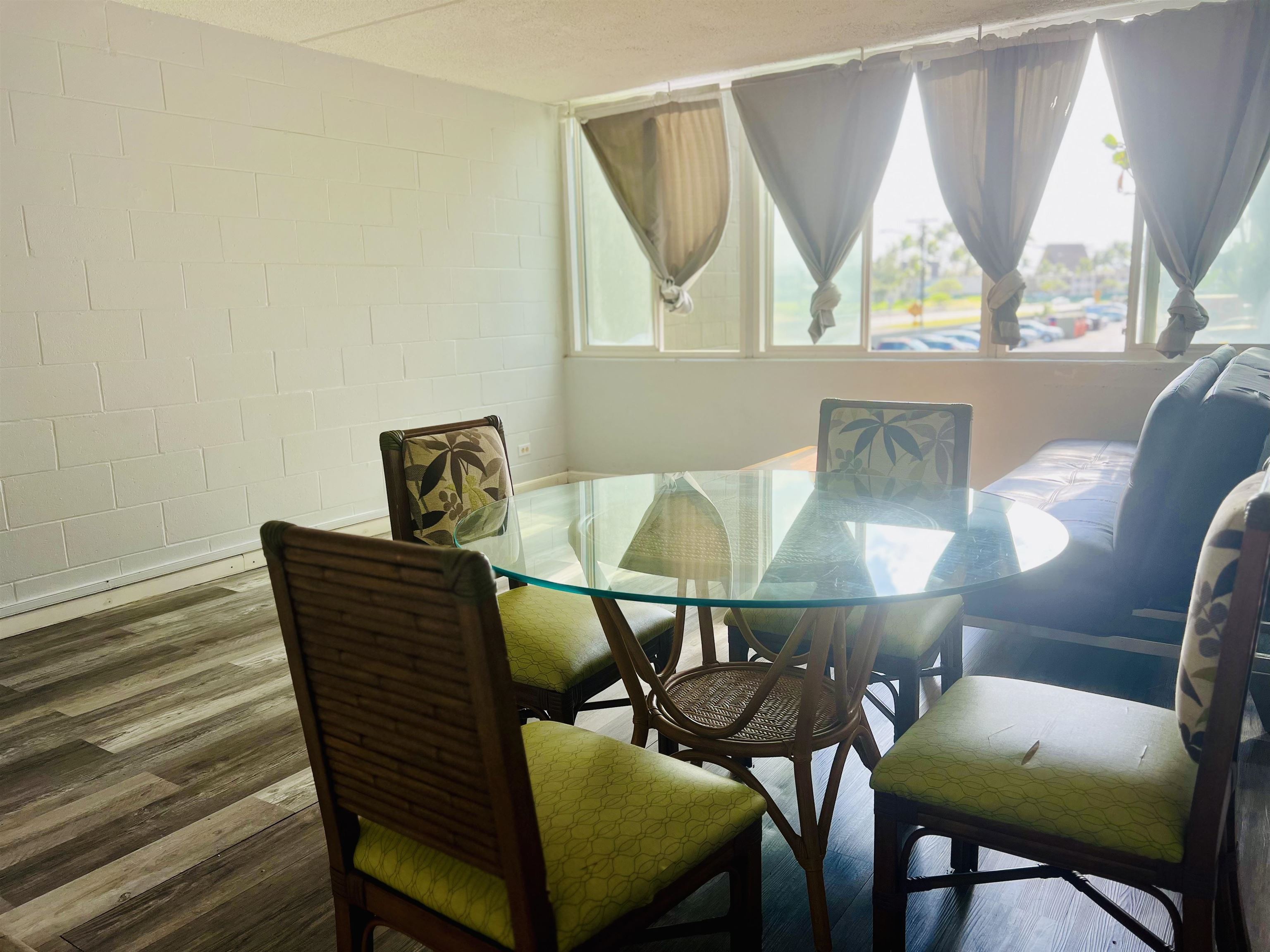 111 Kahului Beach Road, Unit D225 Kahului, HI 96732 - Photo 3 of 31 a view of a dining room with furniture and a window