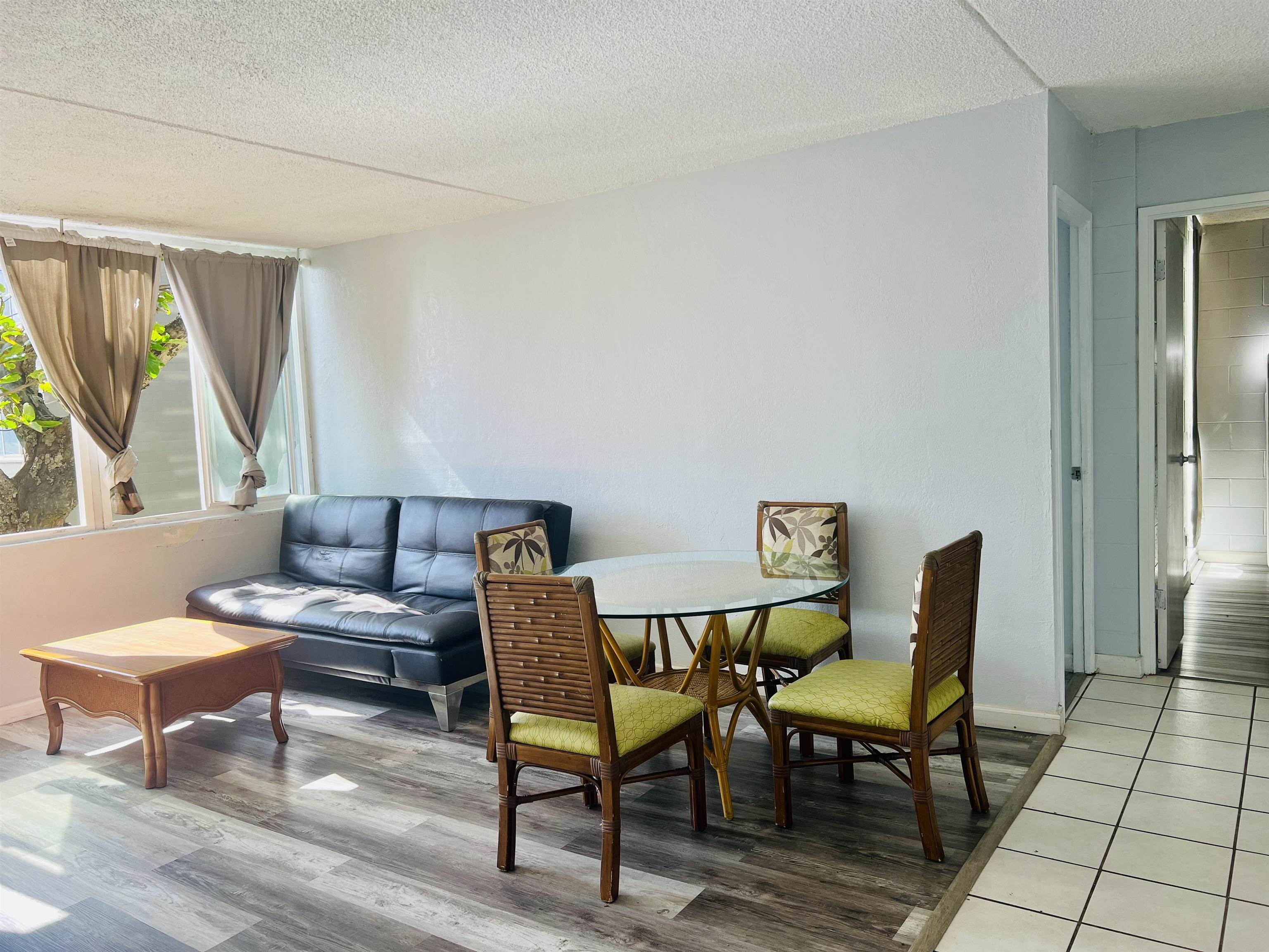 111 Kahului Beach Road, Unit D225 Kahului, HI 96732 - Photo 4 of 31 a living room with furniture and a window
