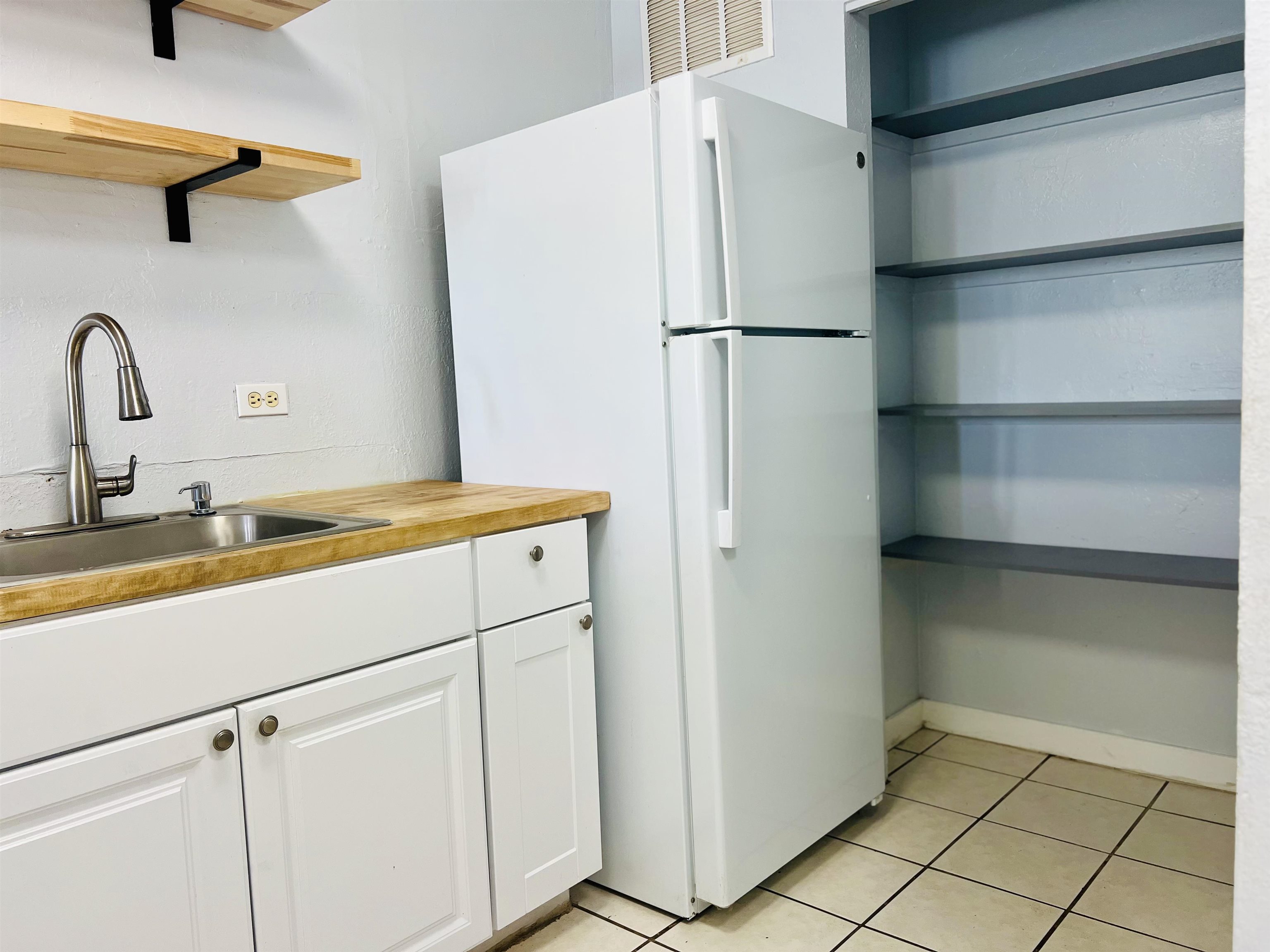 111 Kahului Beach Road, Unit D225 Kahului, HI 96732 - Photo 8 of 31 a white refrigerator freezer sitting inside of a kitchen