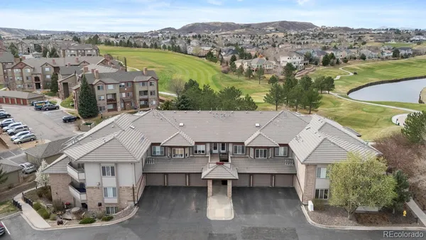 an aerial view of a house with a big yard