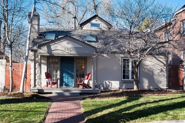 a view of a house with fountain and entertaining space