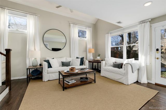 a spacious bedroom with a bed and a couch