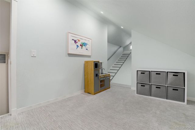 a tree in front of a white house