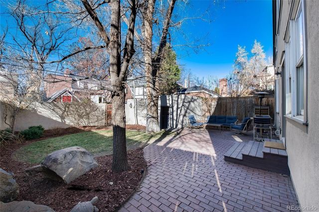 a view of a house with a tree