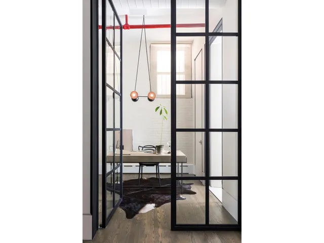 a view of a living room with a floor to ceiling window