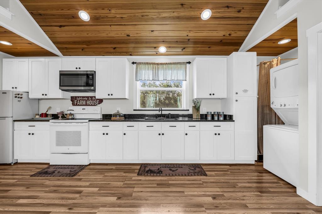 348 Barker Lane Waco, TX 76705 - Photo 29 of 39 a kitchen with stainless steel appliances granite countertop a stove a sink and a refrigerator