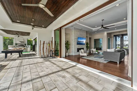 a living room with lots of furniture and kitchen view