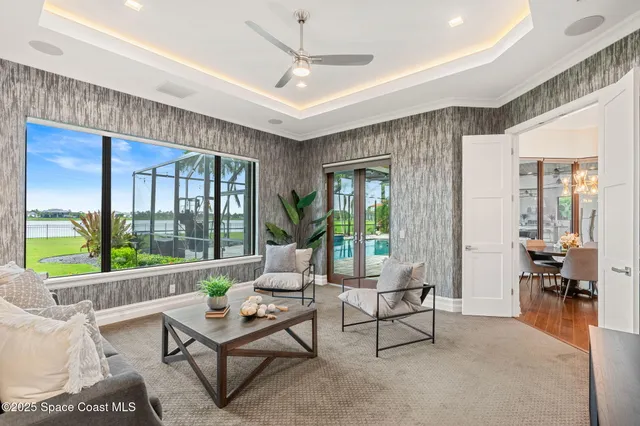 a spacious bathroom with a granite countertop sink a large mirror a bathtub and next to a window