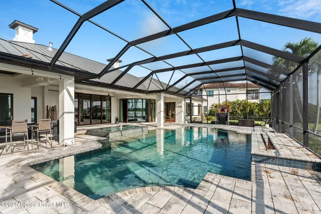 a view of a swimming pool with a porch