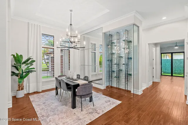 a living room with fireplace furniture and a large window