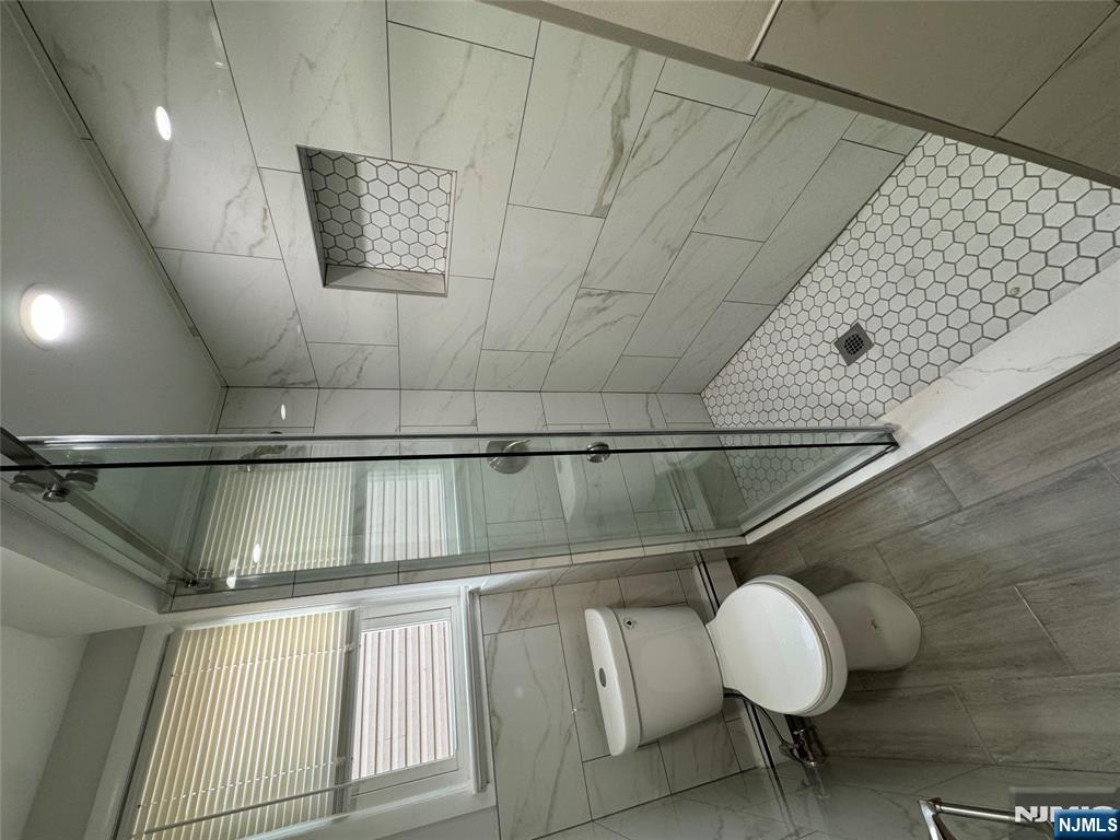 310 Elm Street, Unit 2R Kearny, NJ 07032 - Photo 12 of 14 a bathroom with a toilet and a shower