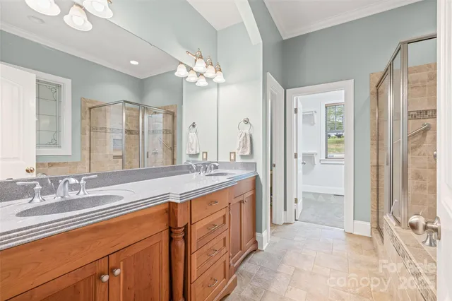 a spacious bathroom with a double vanity sink mirror and double