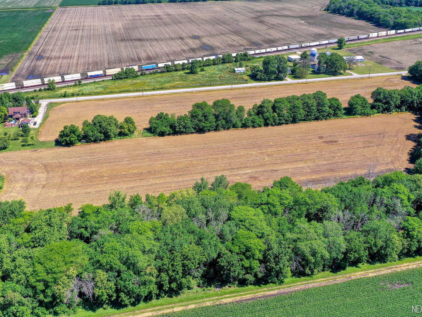 Lot 5 East Grand Ridge Road Mazon, IL 60444 - Photo 4 of 9 a view of a lake with a big yard and large trees