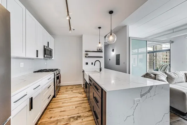a kitchen with cabinets a sink and a stove