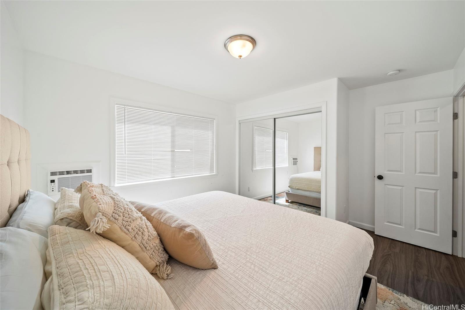 87-1446 Akowai Road Waianae, HI 96792 - Photo 11 of 23 a bedroom with a bed and a cabinets