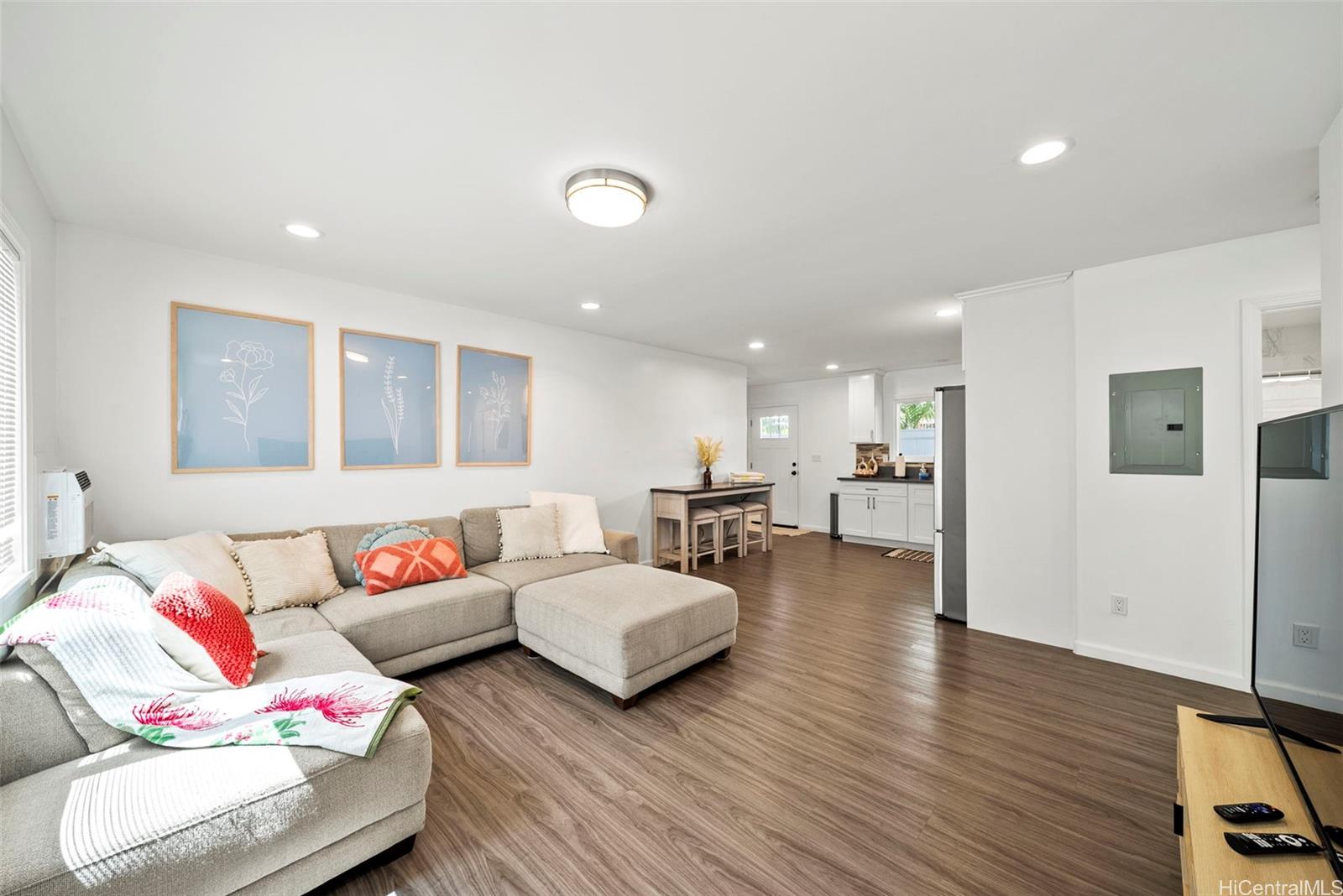 87-1446 Akowai Road Waianae, HI 96792 - Photo 15 of 23 a living room with furniture and a wooden floor