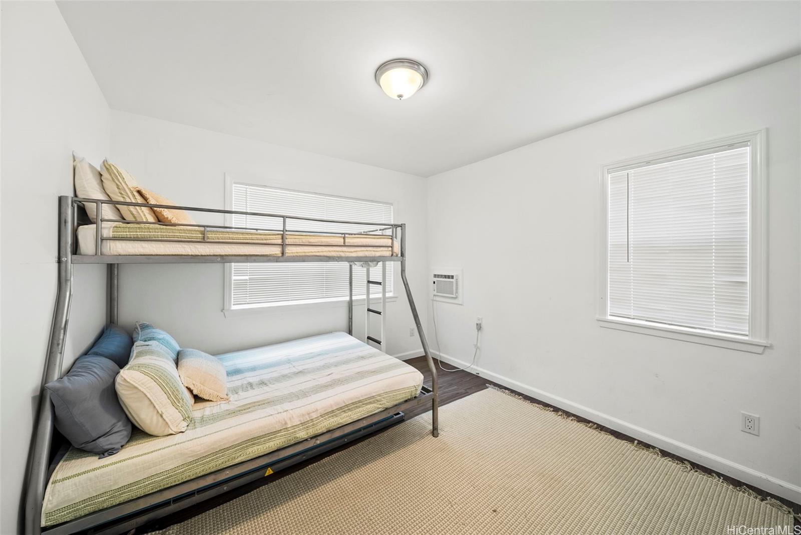 87-1446 Akowai Road Waianae, HI 96792 - Photo 19 of 23 a bedroom with a bed and a window