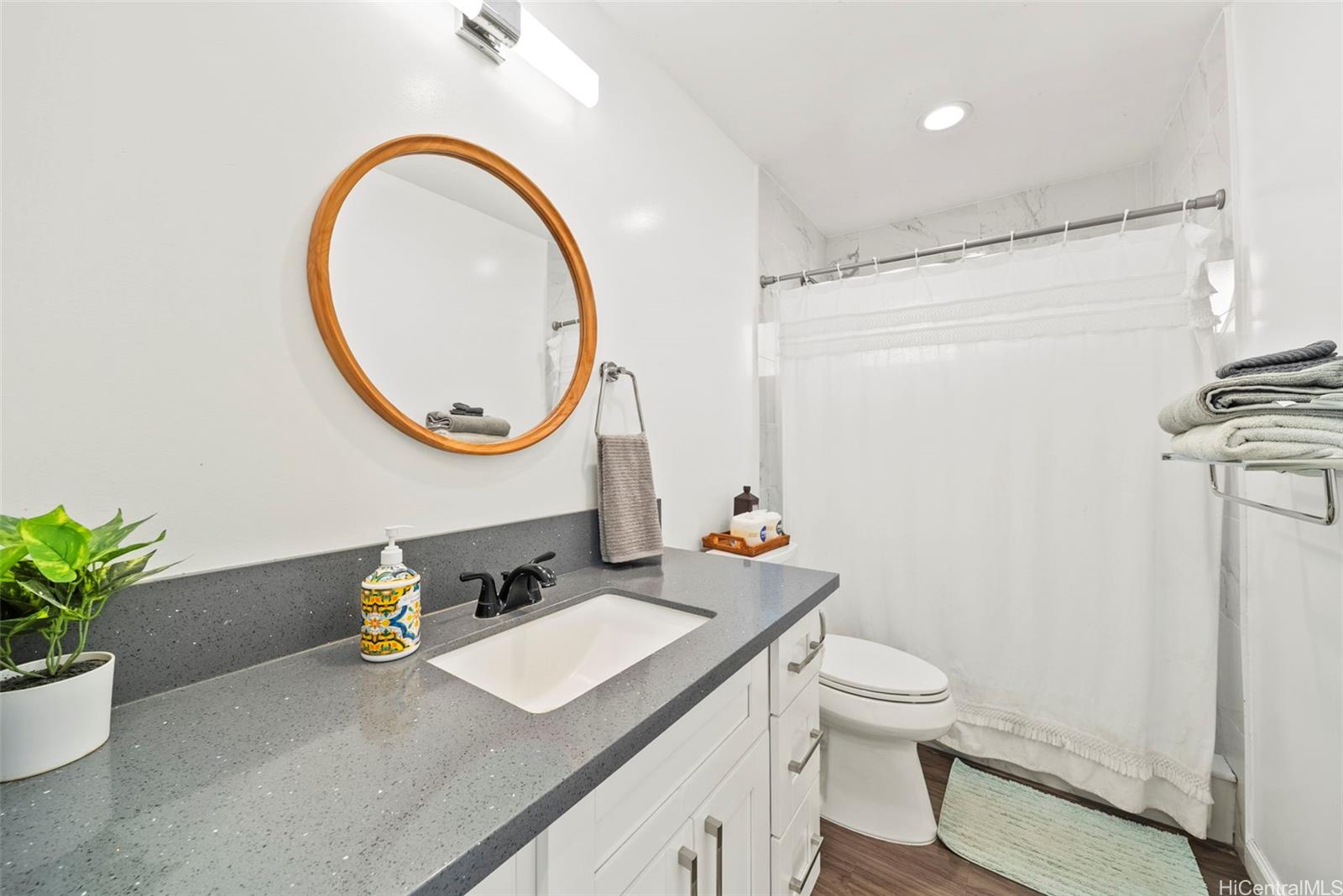 87-1446 Akowai Road Waianae, HI 96792 - Photo 20 of 23 a bathroom with a sink a toilet and a mirror