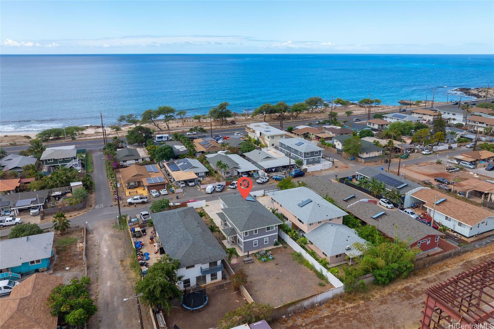 87-1446 Akowai Road Waianae, HI 96792 - Photo 23 of 23 an aerial view of a city with lots of residential buildings and ocean view in back