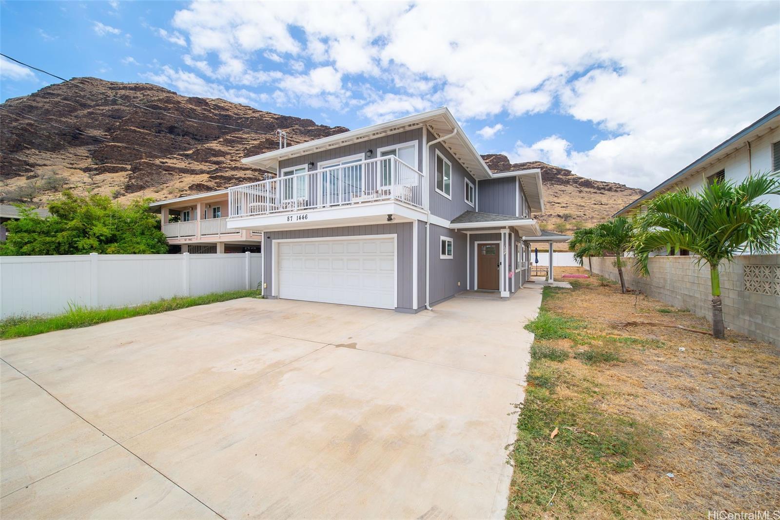 87-1446 Akowai Road Waianae, HI 96792 - Photo 4 of 23 a view of a house with a backyard