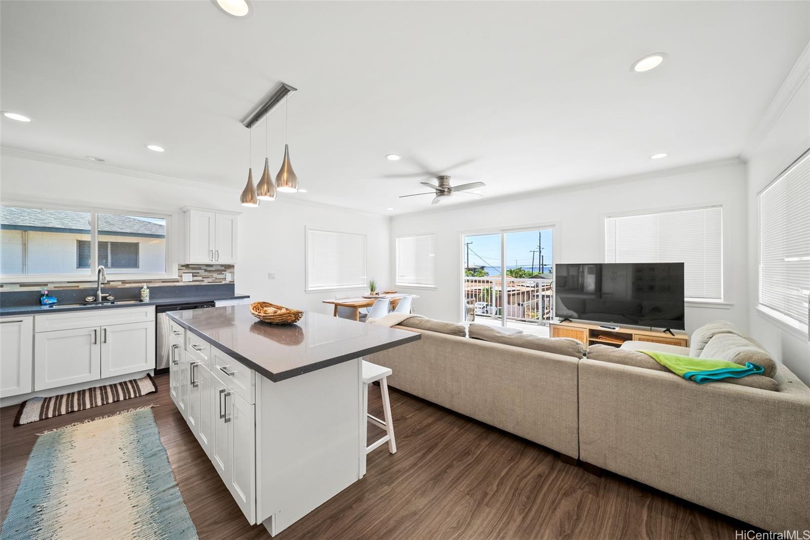 87-1446 Akowai Road Waianae, HI 96792 - Photo 6 of 23 a kitchen with a stove and a white cabinets