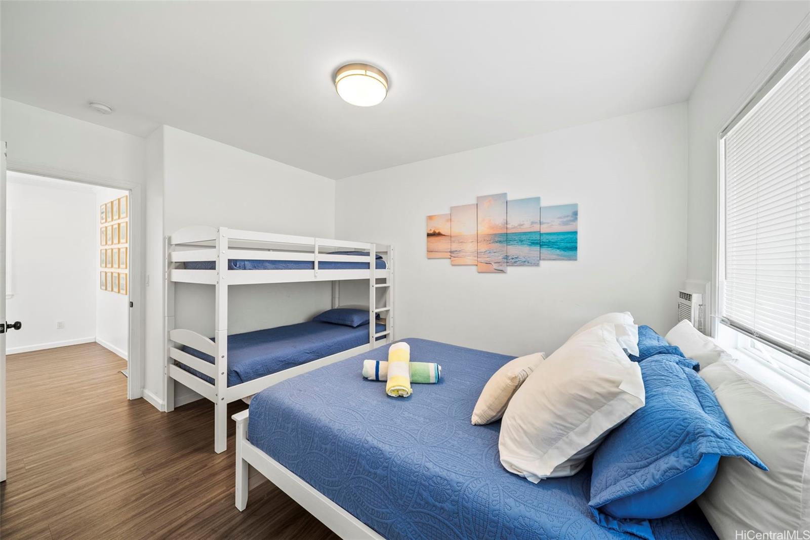 87-1446 Akowai Road Waianae, HI 96792 - Photo 10 of 23 a bedroom with furniture and a wooden floor