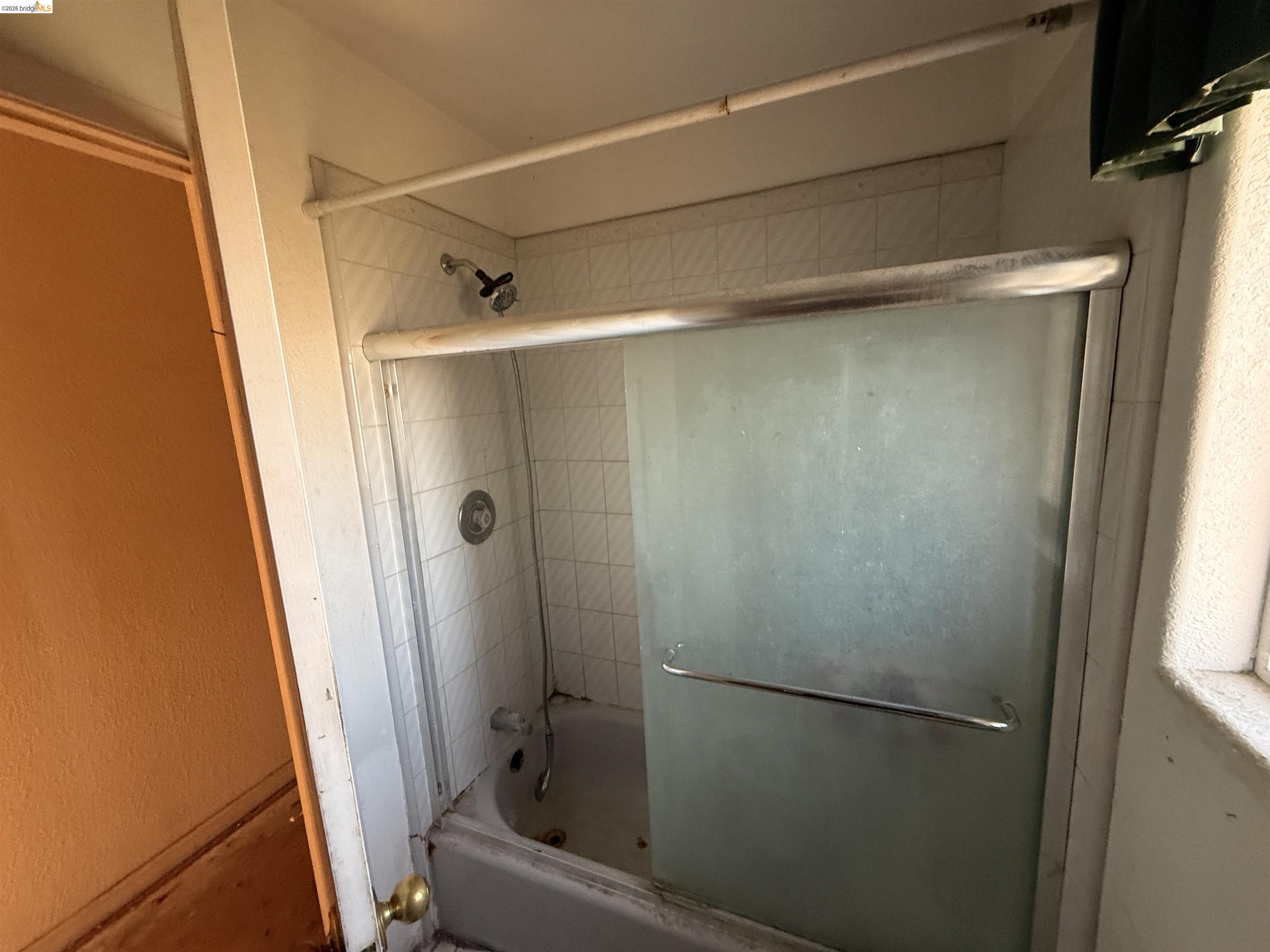 471 Delta Road Oakley, CA 94561 - Photo 3 of 33 a bathroom with a glass shower door and sink