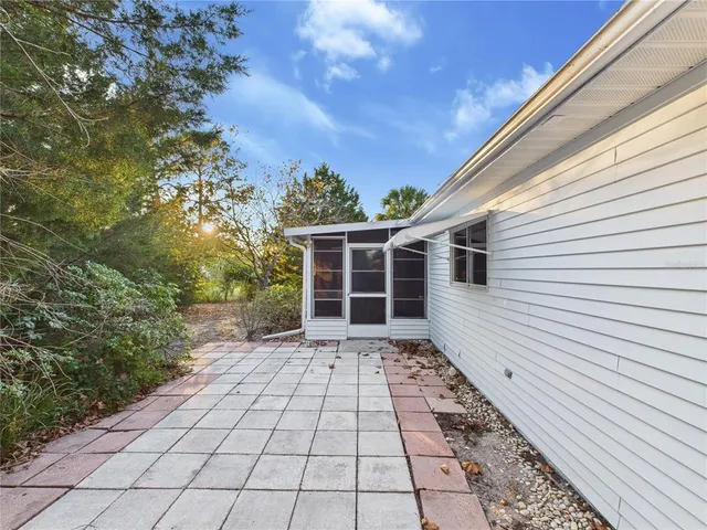 a view of a backyard with pathway