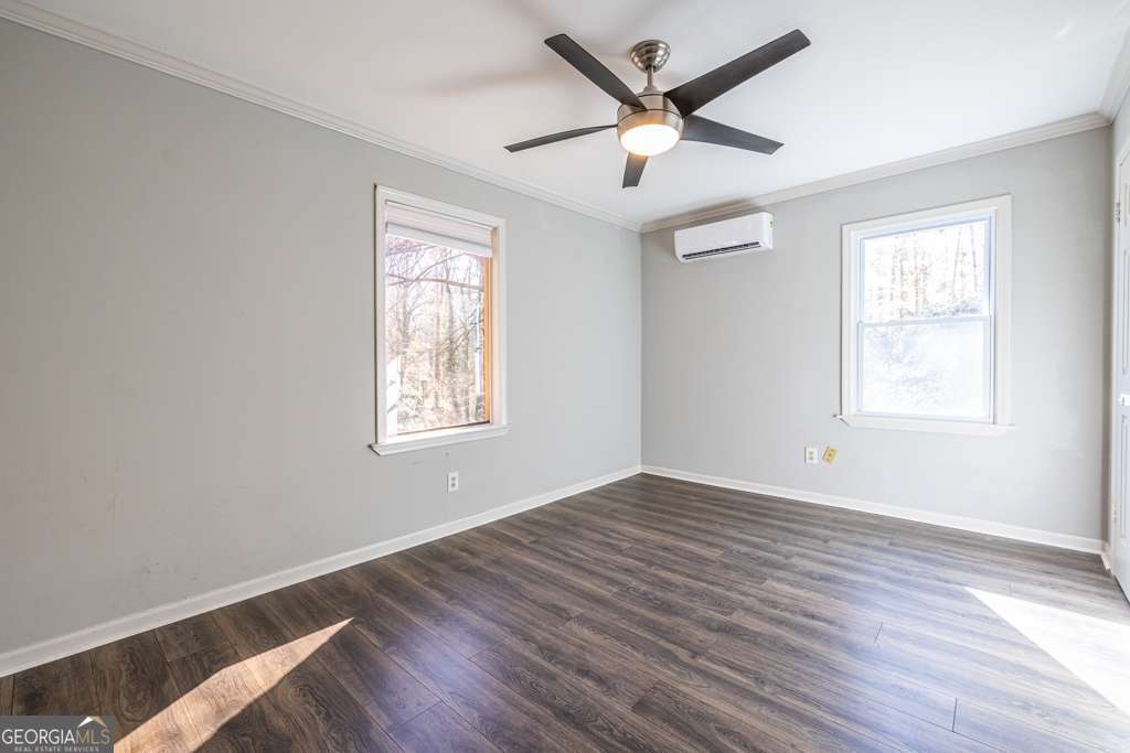 1570 Spring Lane Northwest, Unit B Atlanta, GA 30314 - Photo 18 of 26 wooden floor in an empty room with a window