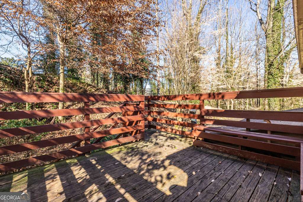 1570 Spring Lane Northwest, Unit B Atlanta, GA 30314 - Photo 24 of 26 a bench sitting in front of a tree