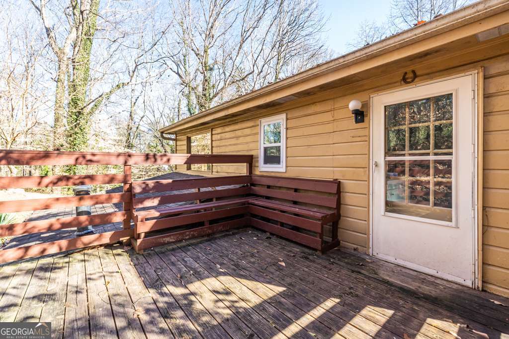 1570 Spring Lane Northwest, Unit B Atlanta, GA 30314 - Photo 25 of 26 a view of a house with a large window and wooden floor