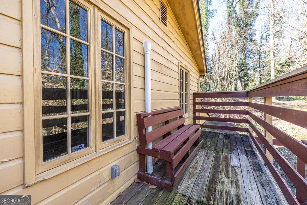 1570 Spring Lane Northwest, Unit B Atlanta, GA 30314 - Photo 3 of 26 a view of a roof deck with wooden floor and fence