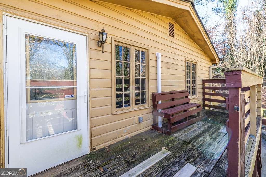 1570 Spring Lane Northwest, Unit B Atlanta, GA 30314 - Photo 4 of 26 a view of a house with a door and wooden floor