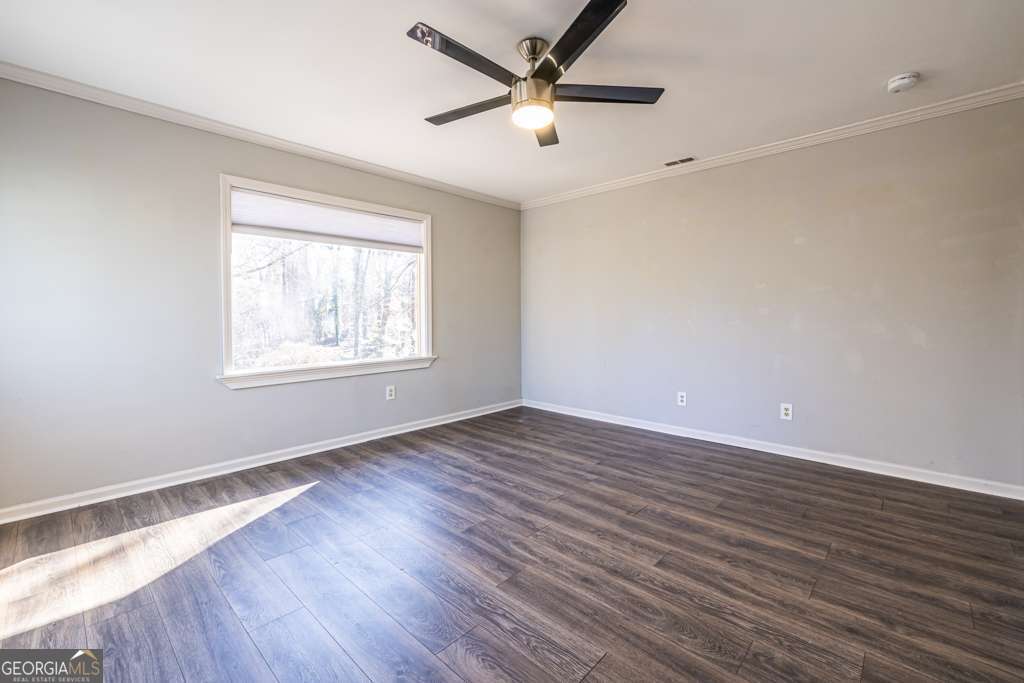 1570 Spring Lane Northwest, Unit B Atlanta, GA 30314 - Photo 8 of 26 wooden floor in an empty room with a window