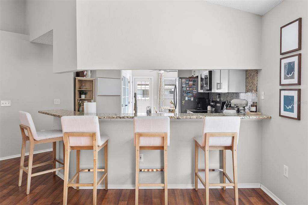 3323 West Pine Street Tampa, FL 33607 - Photo 12 of 32 a kitchen with stainless steel appliances cabinets and chair