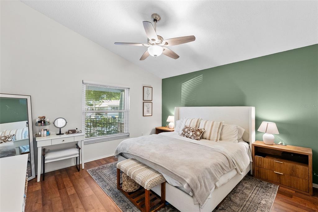 3323 West Pine Street Tampa, FL 33607 - Photo 17 of 32 a bedroom with a bed and a chandelier