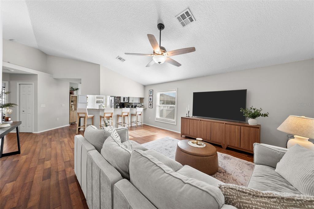 3323 West Pine Street Tampa, FL 33607 - Photo 2 of 32 a living room with furniture and a flat screen tv
