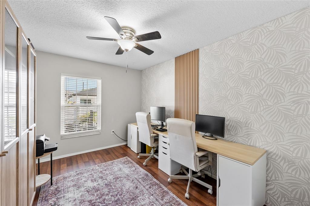3323 West Pine Street Tampa, FL 33607 - Photo 22 of 32 a view of a workspace with furniture and a window