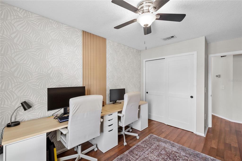 3323 West Pine Street Tampa, FL 33607 - Photo 23 of 32 a view of a workspace with furniture and wooden floor