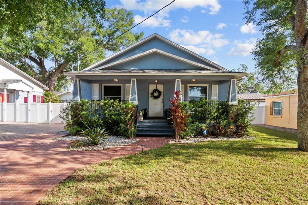 3323 West Pine Street Tampa, FL 33607 - Photo 30 of 32 a front view of a house with a yard