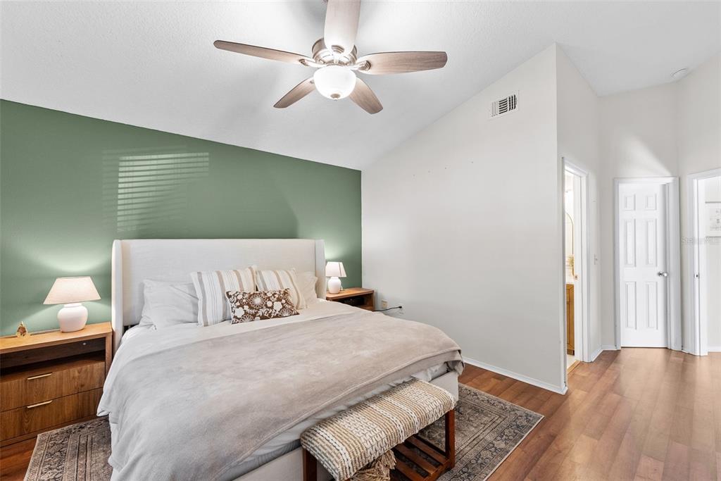 3323 West Pine Street Tampa, FL 33607 - Photo 3 of 32 a bedroom with a bed and a chandelier