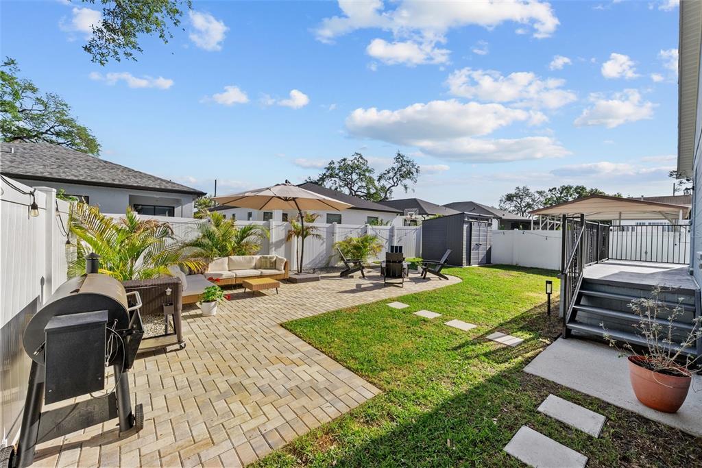 3323 West Pine Street Tampa, FL 33607 - Photo 4 of 32 a view of a backyard with sitting area