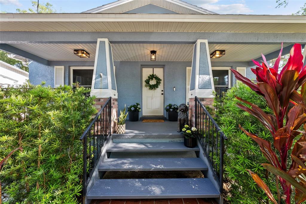3323 West Pine Street Tampa, FL 33607 - Photo 5 of 32 a view of a house with potted plants