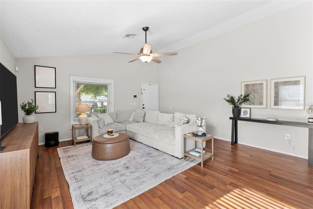 3323 West Pine Street Tampa, FL 33607 - Photo 9 of 32 a living room with furniture and a wooden floor