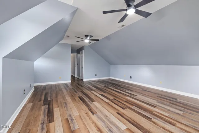 a bathroom with a tub sink shower and view