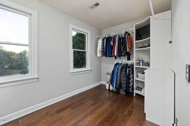 a view of a backyard with table and chairs