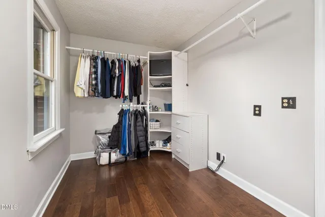 a view of a house with a yard and plants