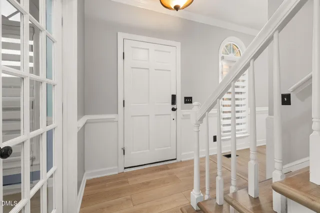 a view of room with window ceiling fan and wooden floor