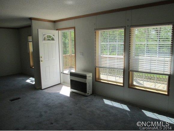 141 Prairie Cottage Road Clyde, NC 28721 - Photo 4 of 20 a view of an empty room with a window